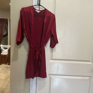 Robe in new condition in a beautiful satin ruby red .  Worn once.